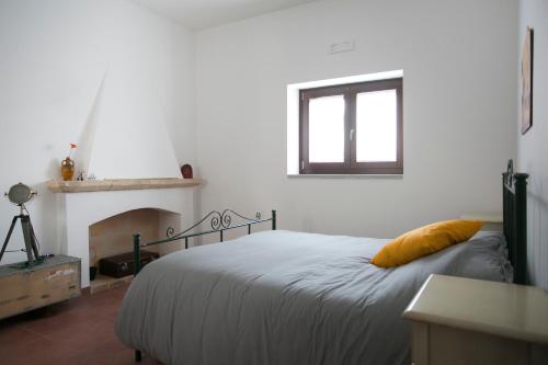 Postel nebo postele na pokoji v ubytování Masseria Stella