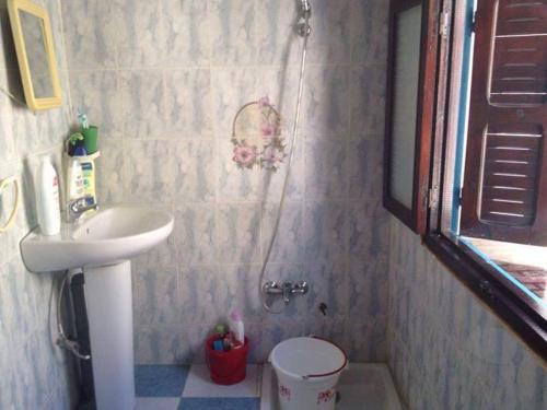 a bathroom with a shower with a sink and a toilet at Apartamento Martil in Martil
