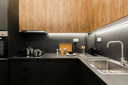 a kitchen with a sink and a counter top at Harmony Sea View Apartment in Thessaloniki