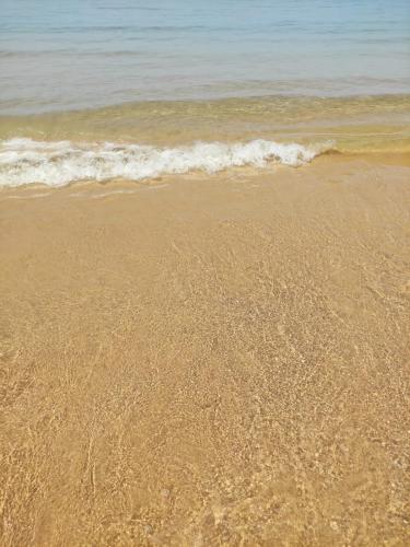 a sandy beach with the ocean in the background at La Foggia seaside paradise in Siculiana