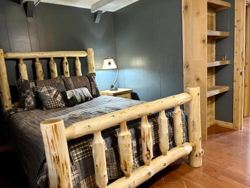 a bedroom with a wooden bed in a room at Abundant Acres Retreat in Beech Mountain