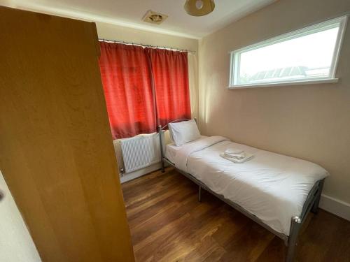 a small room with two beds and a window at ST NICHOLAS HOTEL in Kenton