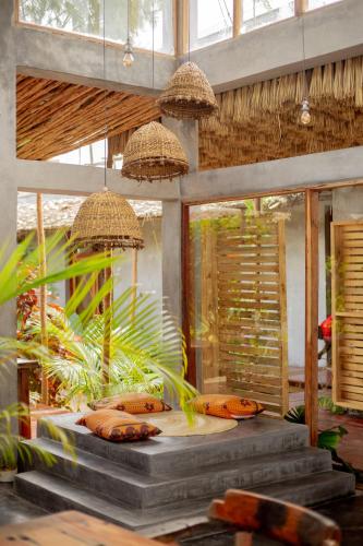 a room with a table with bananas on it at The Garten Living in Paje