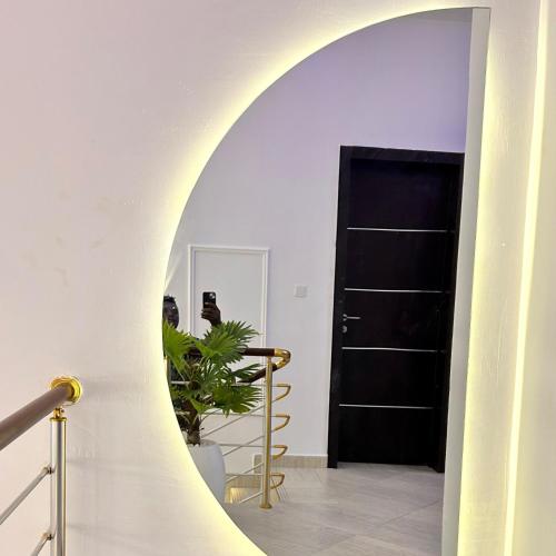 a hallway with an archway and a black door at Luxury Shortlet Apartment Ajah, Lekki Lagos in Lagos