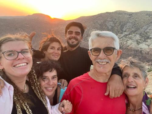 a group of people posing for a picture at sunset at Dana historic village in Dana