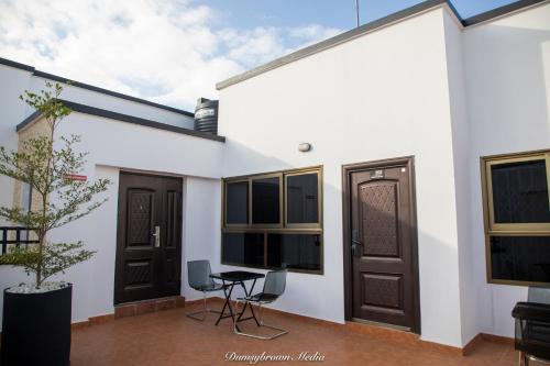 a view of a house with a table and chairs at Executive Large Room with Ensuite in Accra