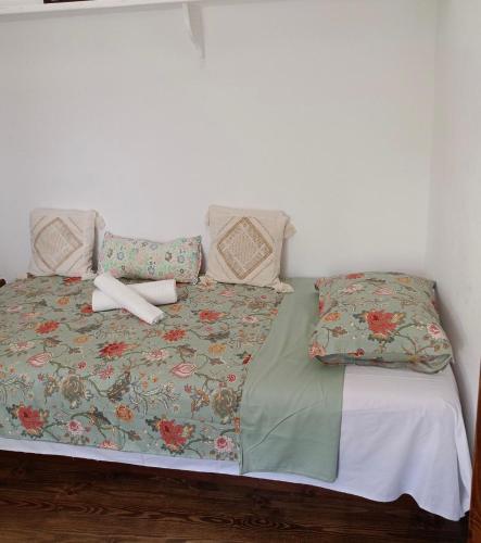 a bed with a cross on top of it at Guest House Pafili in Zagora