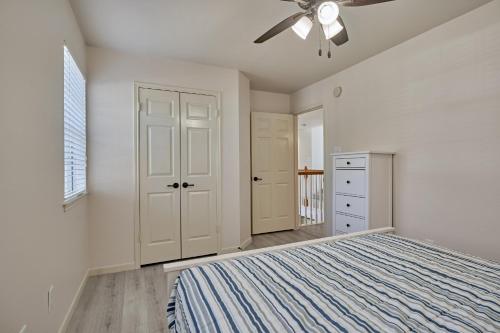 a bedroom with a bed and a ceiling fan at New! Pool, Spa, Nature Trails - The Woodlands 4BR Forest Retreat! in Spring
