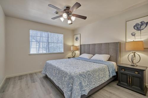 a bedroom with a bed and a ceiling fan at New! Pool, Spa, Nature Trails - The Woodlands 4BR Forest Retreat! in Spring