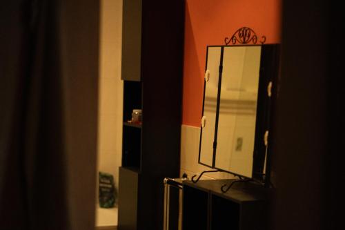 a mirror on top of a dresser in a room at Repton house in Woodford