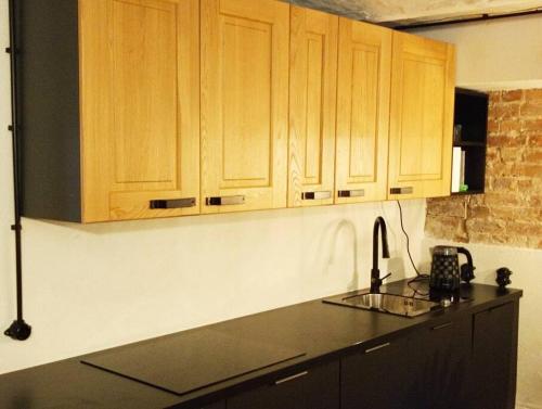 Kuchyň nebo kuchyňský kout v ubytování Klimatyczne Studio 3B z parkingiem