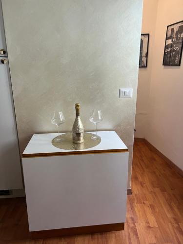 a white dresser with two wine glasses on it at PARIOLI LUXURY HOME in Rome