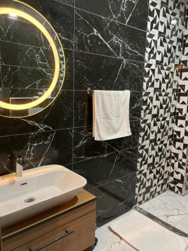 a bathroom with a sink and a mirror at Ulusoy Old Cıty in Istanbul