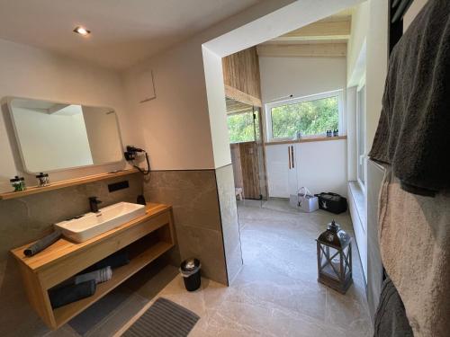 a bathroom with a sink and a mirror at Alpenglück - Hinterthal in Hinterthal