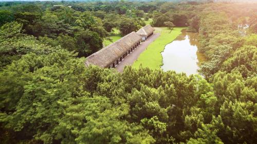 an aerial view of a train on a track near a river at Hotel Reserva de Piedemonte in Villavicencio
