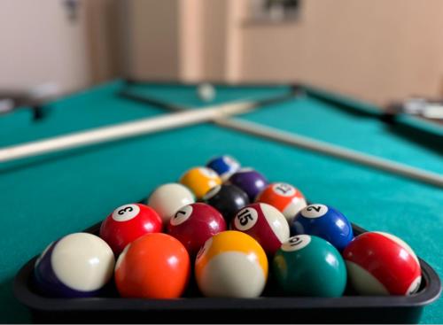 a group of billiard balls on a pool table at Holiday house "Mimoza" 2 massage pools in Otočac