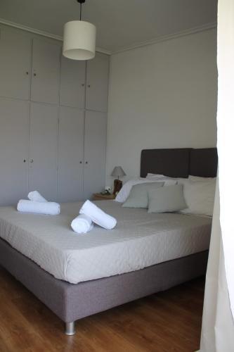 Ένα ή περισσότερα κρεβάτια σε δωμάτιο στο Blue Side Apartment in Porto Rafti