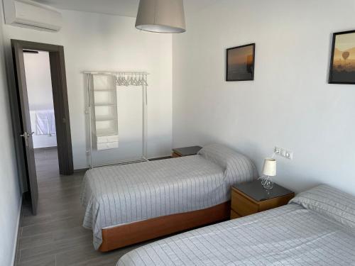 A bed or beds in a room at Villa La Fuente