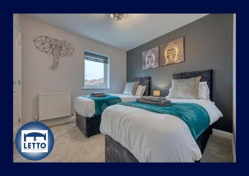 a bedroom with two beds and a sign that says lift at Letto Serviced Accommodation Peterborough - Oakcroft House - PE7 FREE Parking in Peterborough