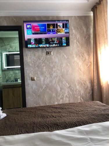 En eller flere senge i et værelse på Hotel LION Almaty