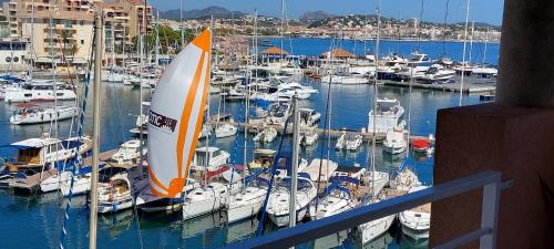 a group of boats docked in a marina at Apartment Hirondelle Port Frejus in Fréjus