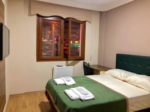 Postel nebo postele na pokoji v ubytování Trabzon Akgüller Apart