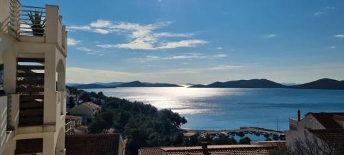 a view of the ocean from a building at Apartmani Srdarović in Drage