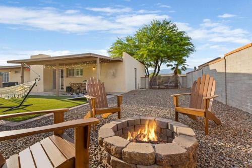 a backyard with two chairs and a fire pit at Pool, Fire Pit, Ping-Pong in Tucson