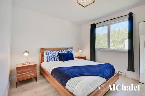 Ένα ή περισσότερα κρεβάτια σε δωμάτιο στο Halte- Domaine du Grand-Portneuf