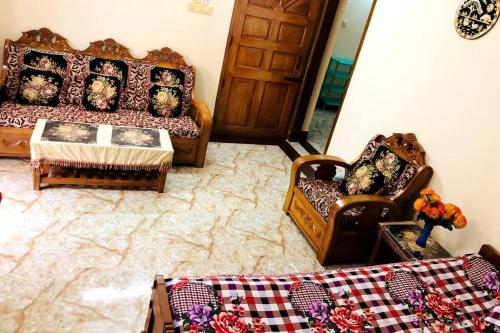 a living room with a couch and two chairs at Modern 3 Bedroom Flat in Sylhet in Sylhet