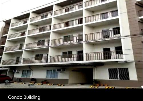 an apartment building with balconies on the side of it at Condo Transient Near NAIA Airport-Unlimited Internet v2 in Manila