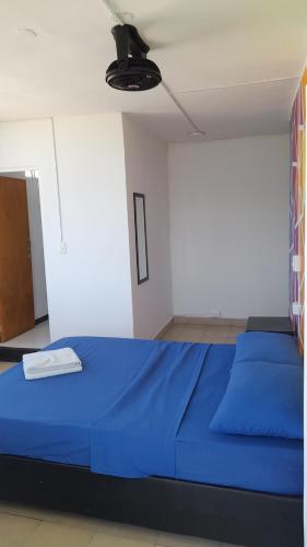 Una cama o camas en una habitación de Panamerican Hostel