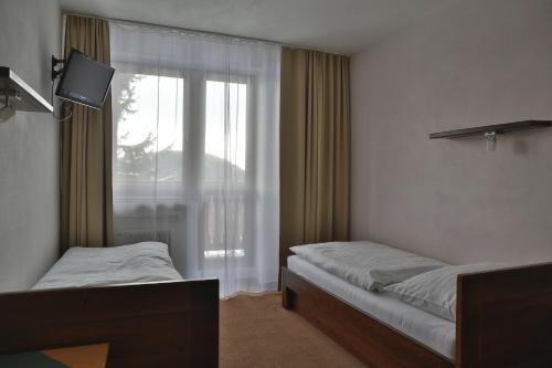 Katil atau katil-katil dalam bilik di Hotel Polianka