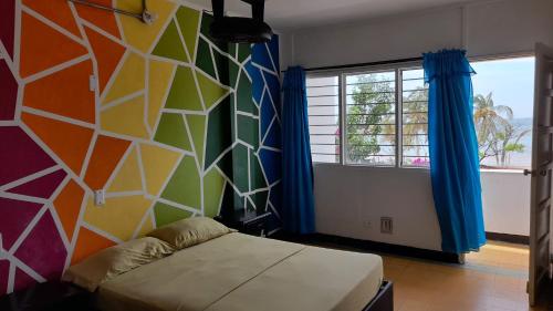 Una cama o camas en una habitación de Panamerican Hostel
