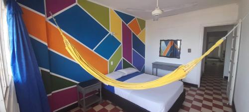 Una cama o camas en una habitación de Panamerican Hostel