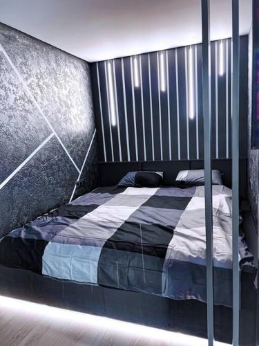 Tempat tidur dalam kamar di Boutique Studio Apartment