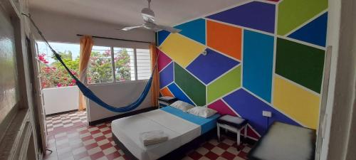 Una cama o camas en una habitación de Panamerican Hostel