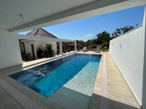 a swimming pool in the backyard of a house at TREND in Arad