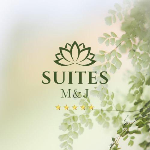 a logo for a company with a lotuses and leaves at Studio SUITE M&J in Caracas