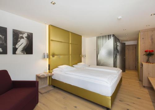 Ένα ή περισσότερα κρεβάτια σε δωμάτιο στο Das Reisch