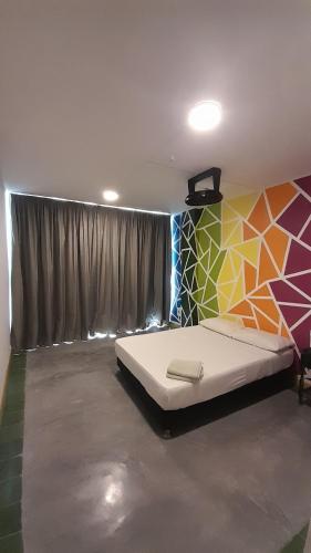 Una cama o camas en una habitación de Panamerican Hostel