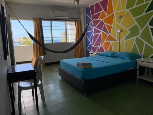 Una cama o camas en una habitación de Panamerican Hostel