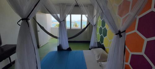 Una cama o camas en una habitación de Panamerican Hostel