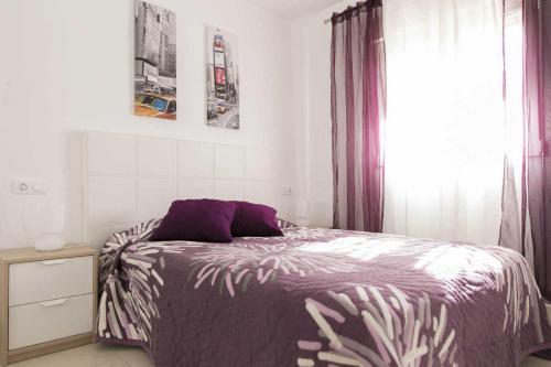 Een bed of bedden in een kamer bij Apartment Aguila Real