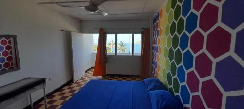 Una cama o camas en una habitación de Panamerican Hostel