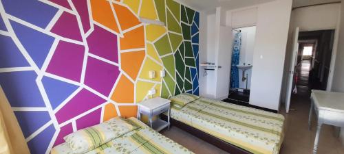 Una cama o camas en una habitación de Panamerican Hostel
