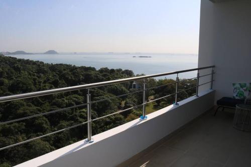 a balcony with a view of the ocean at 16H Luxury Oceanview Playa Bonita Resort Panama in ArraijÃ¡n