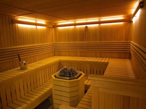 a large wooden sauna with lights on the inside at 16H Luxury Oceanview Playa Bonita Resort Panama in ArraijÃ¡n