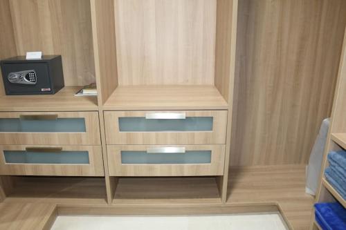 a wooden dresser with a tv on top of it at 15B Stunning Oceanfront Views Panama Resort Life in ArraijÃ¡n