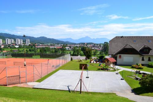 an aerial view of a tennis court with a tennis court at Mini Hotel in Škofja Loka